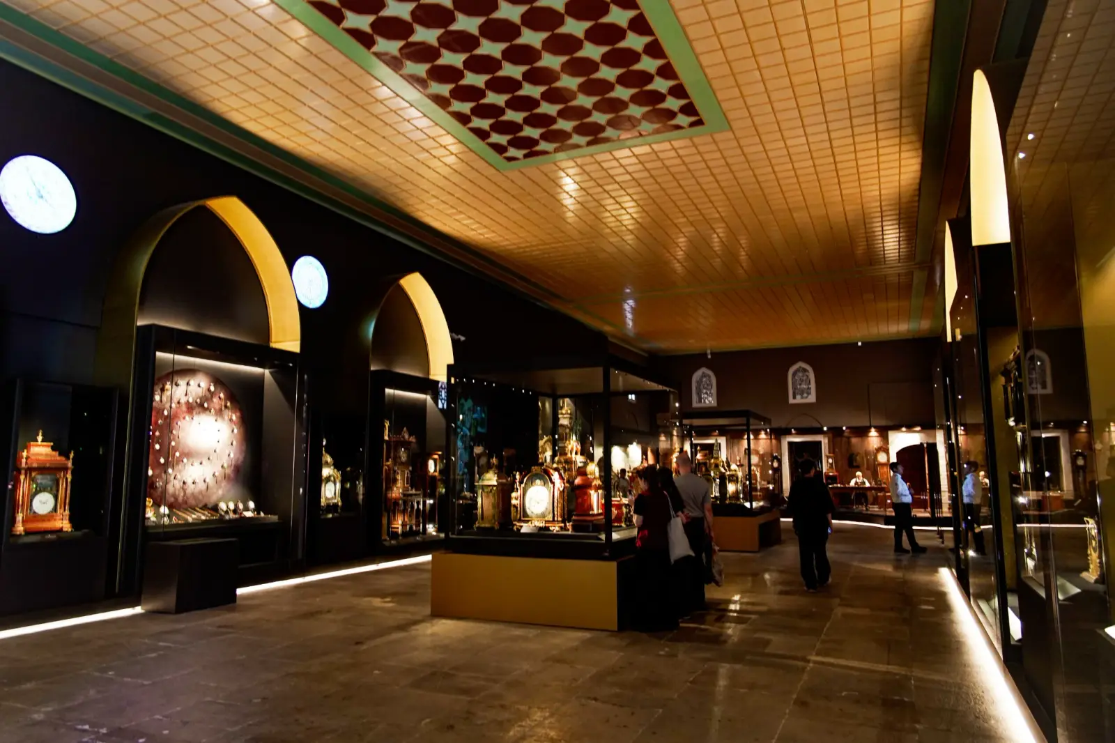 The Clock Museum in the former Imperial Stables, its cases running the length of the hall.