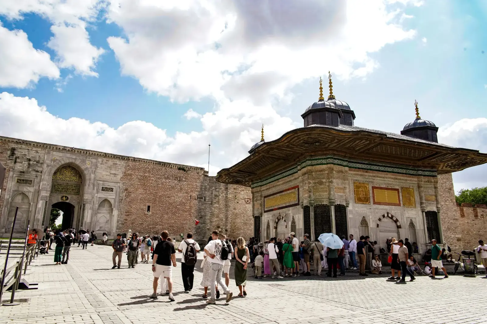 The Fountain of Ahmed III outside the Imperial Gate, its carved marble panels under wide eaves.