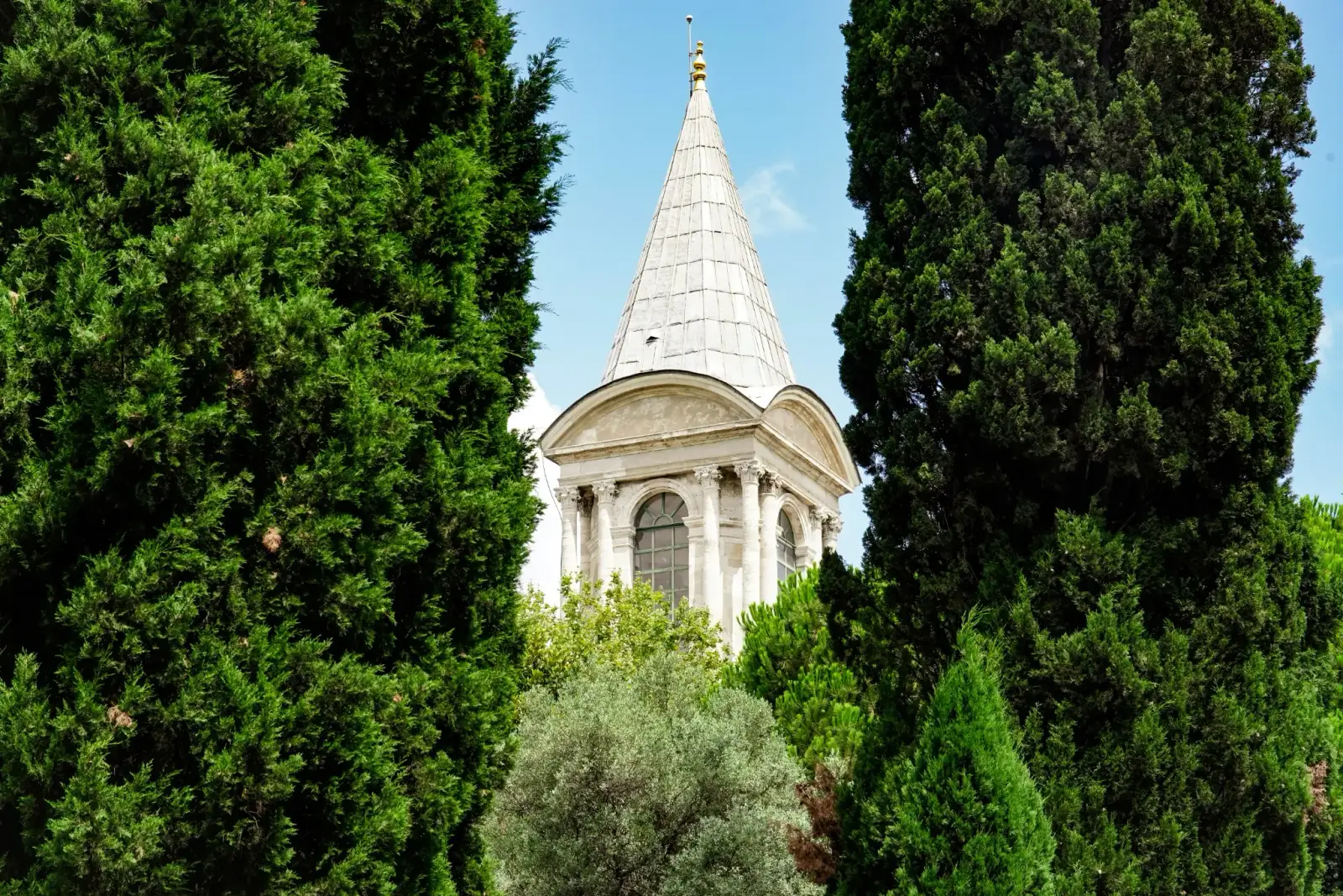 The lead-covered spire and arched lantern at the top of the Tower of Justice.
