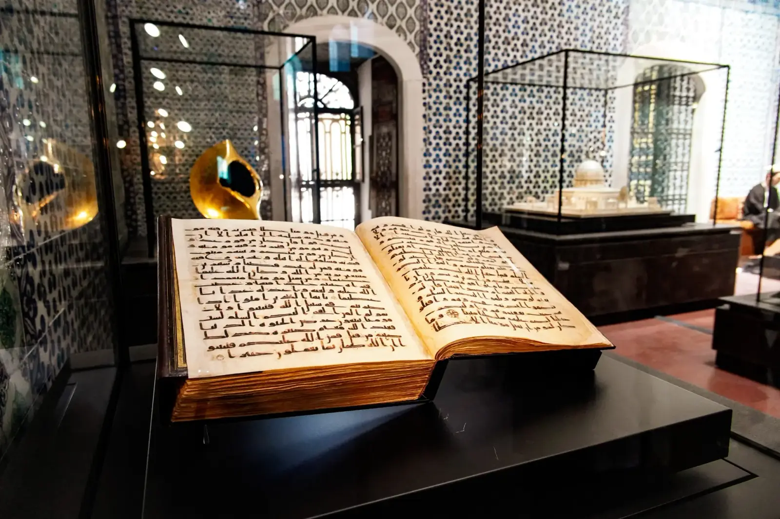 An early Quran manuscript in Kufic script, open in its case in the Sacred Relics.