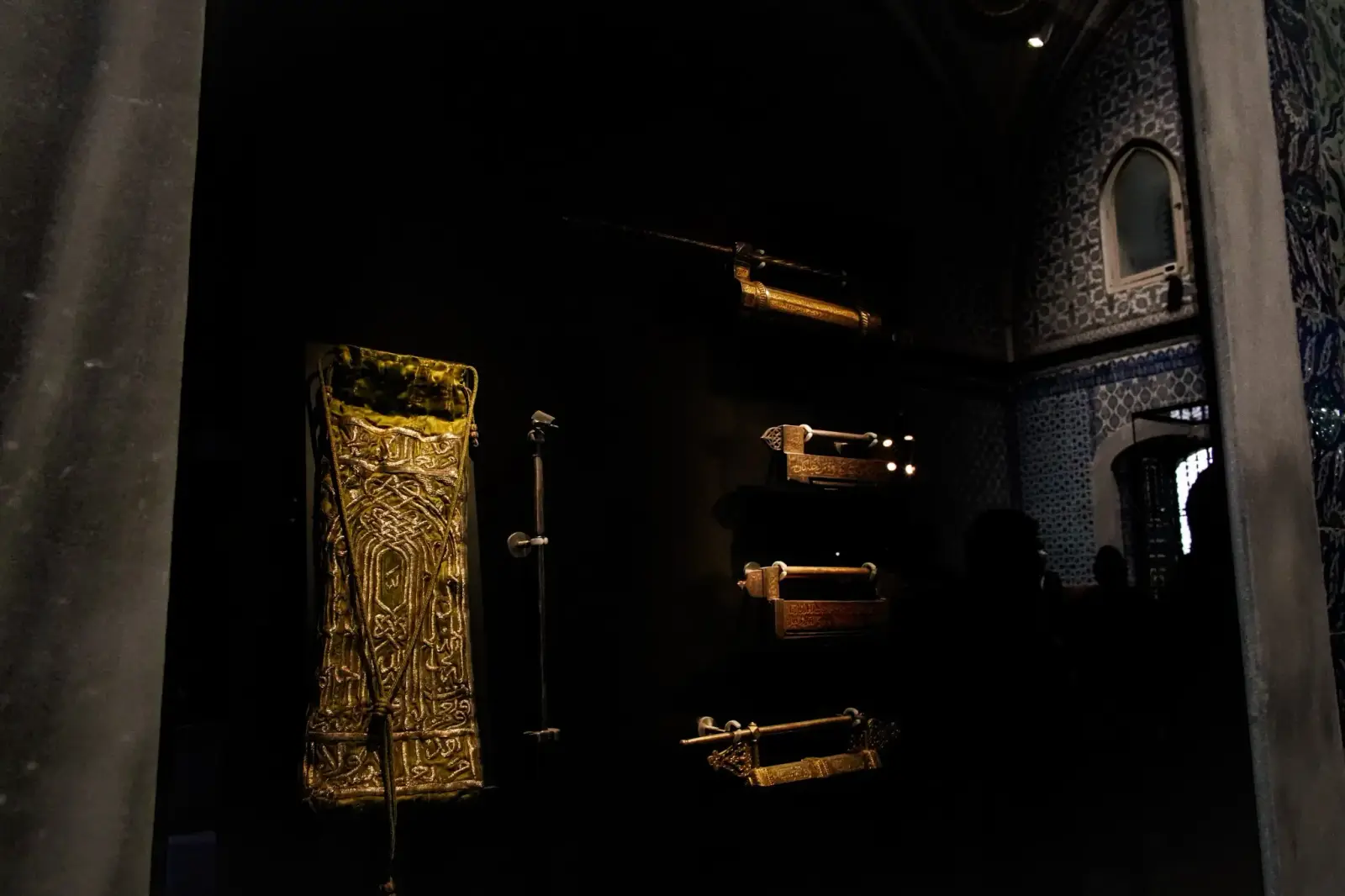 Gilded relics and swords displayed in the Chamber of the Sacred Relics.