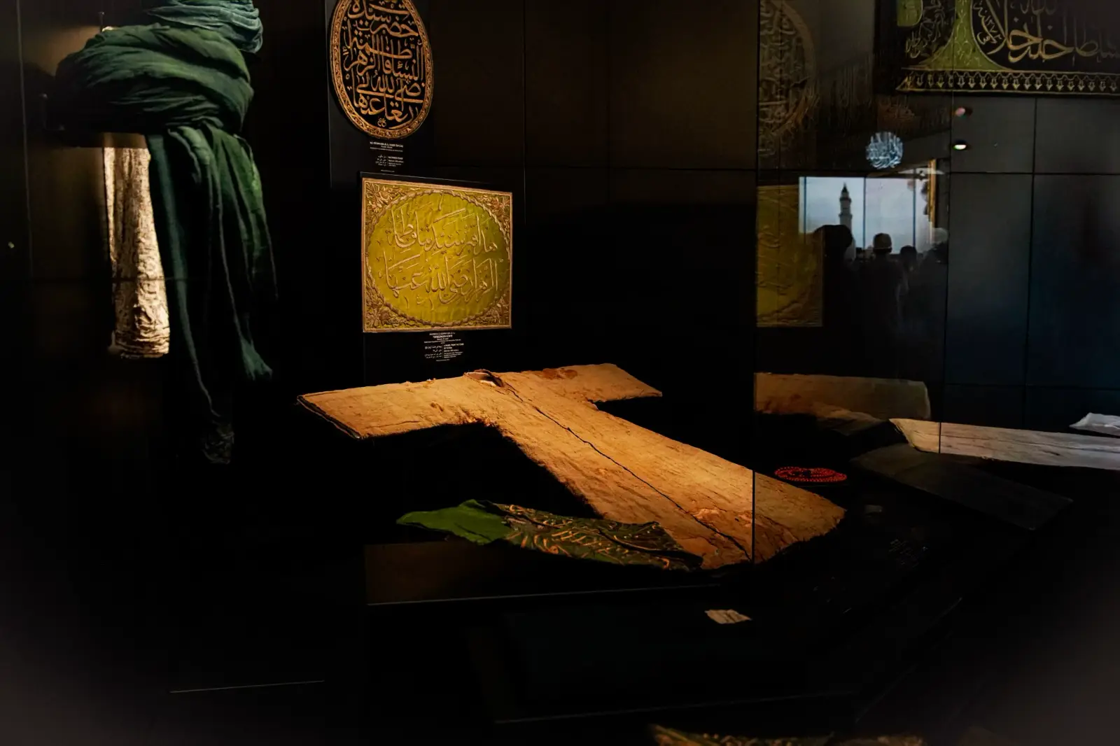 The chamber of the Holy Mantle, gilded panels and a green turban beside the case.
