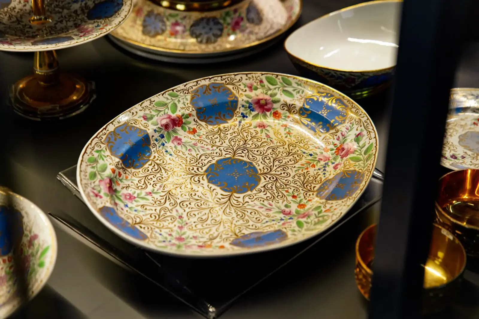 A gilded dish with blue medallions, made for the Ottoman market.